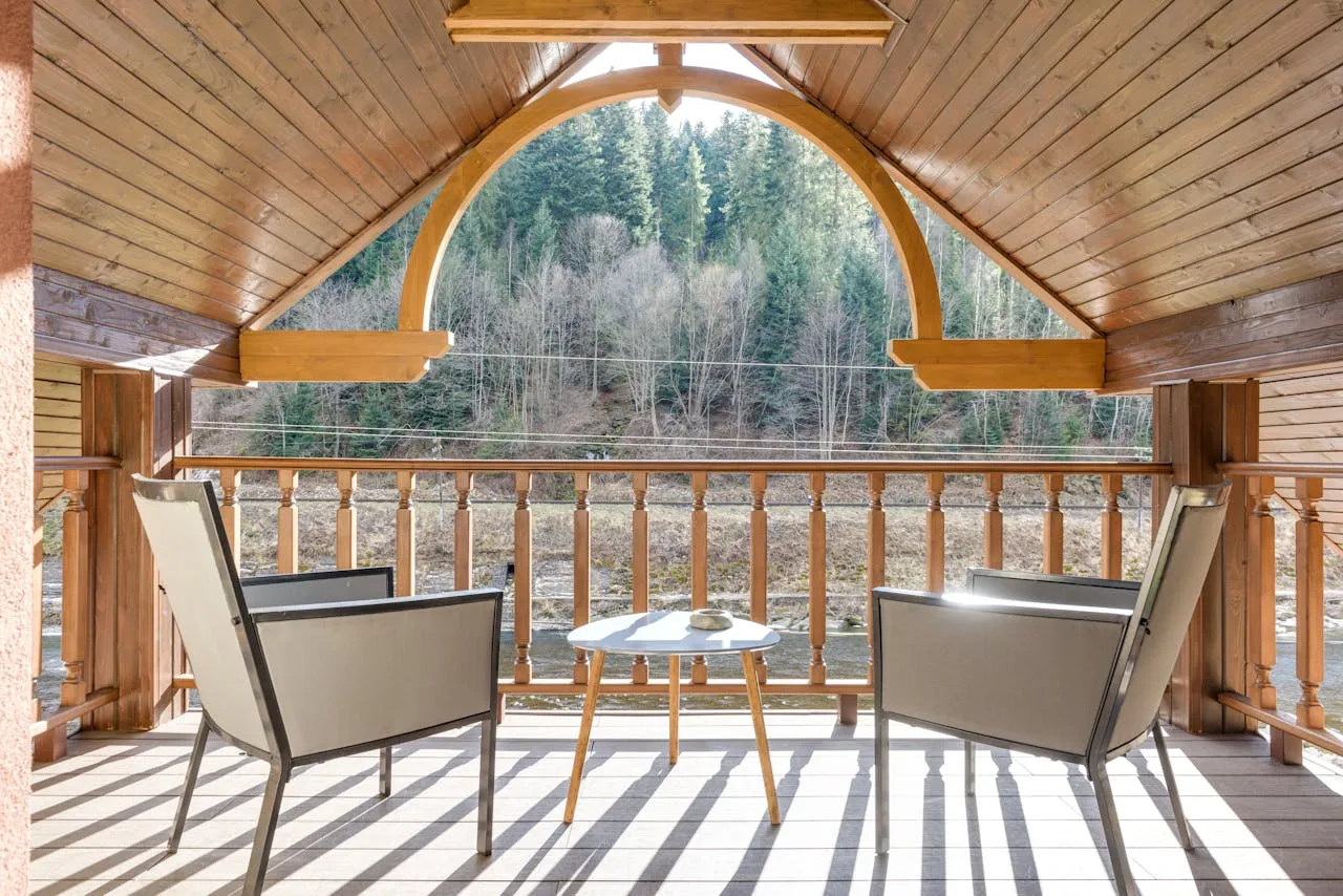 An enclosed porch with seating