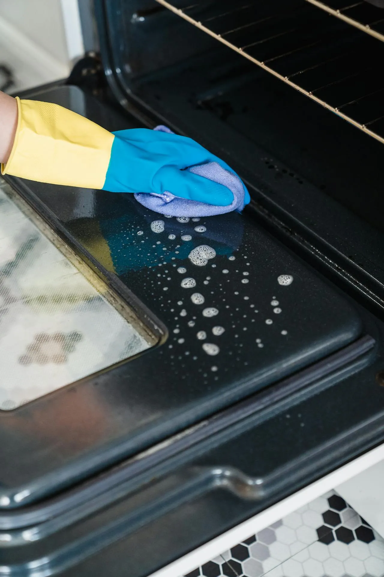 Wiping down a glass stovetop