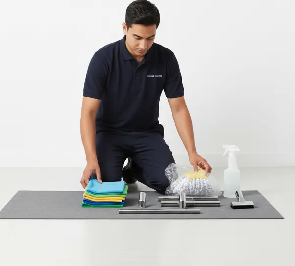 A technician laying out freshly laundered cloths and sanitized tools